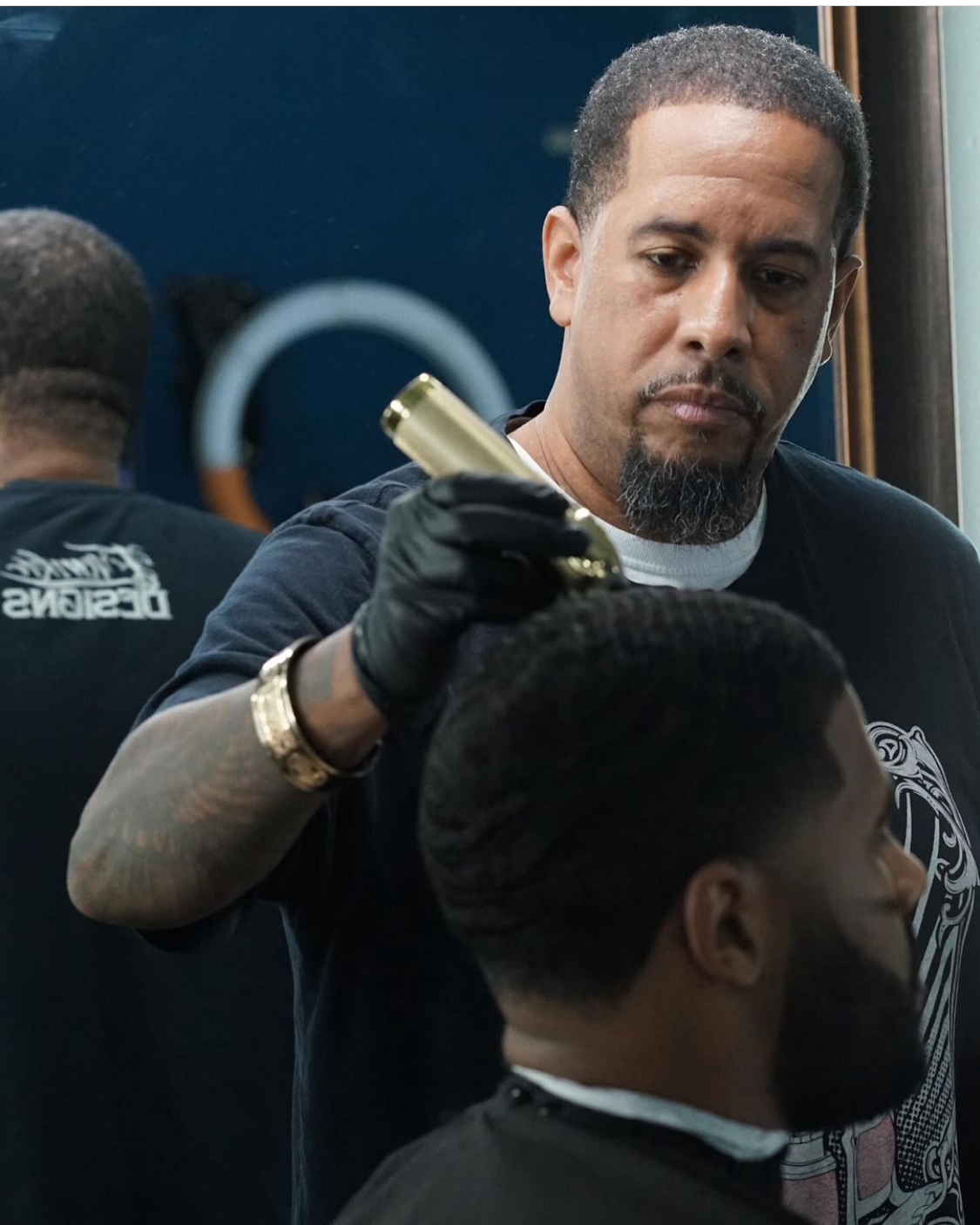 Karim Reem Bevans providing a professional barbering service
